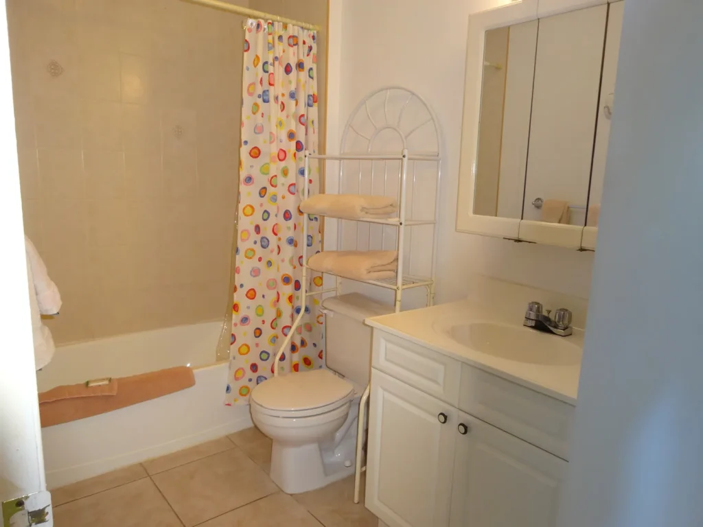 Bathroom with bath and shower at Sunset Paradise 3
