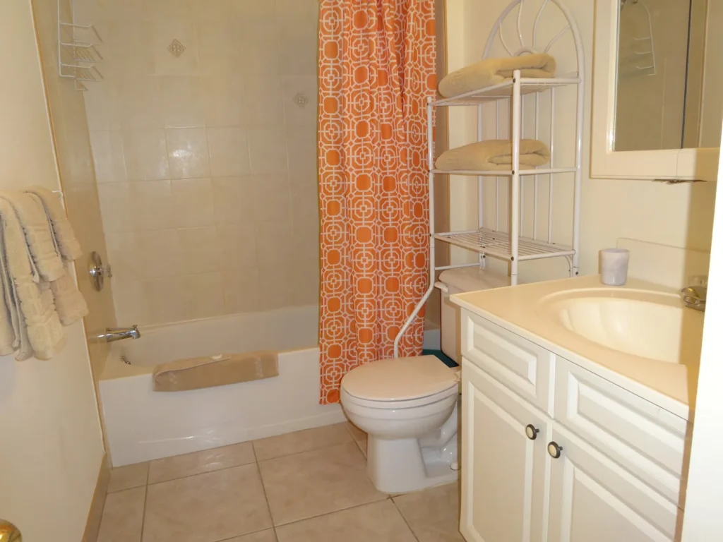 Bathroom with bath and shower at Sunset Paradise 1