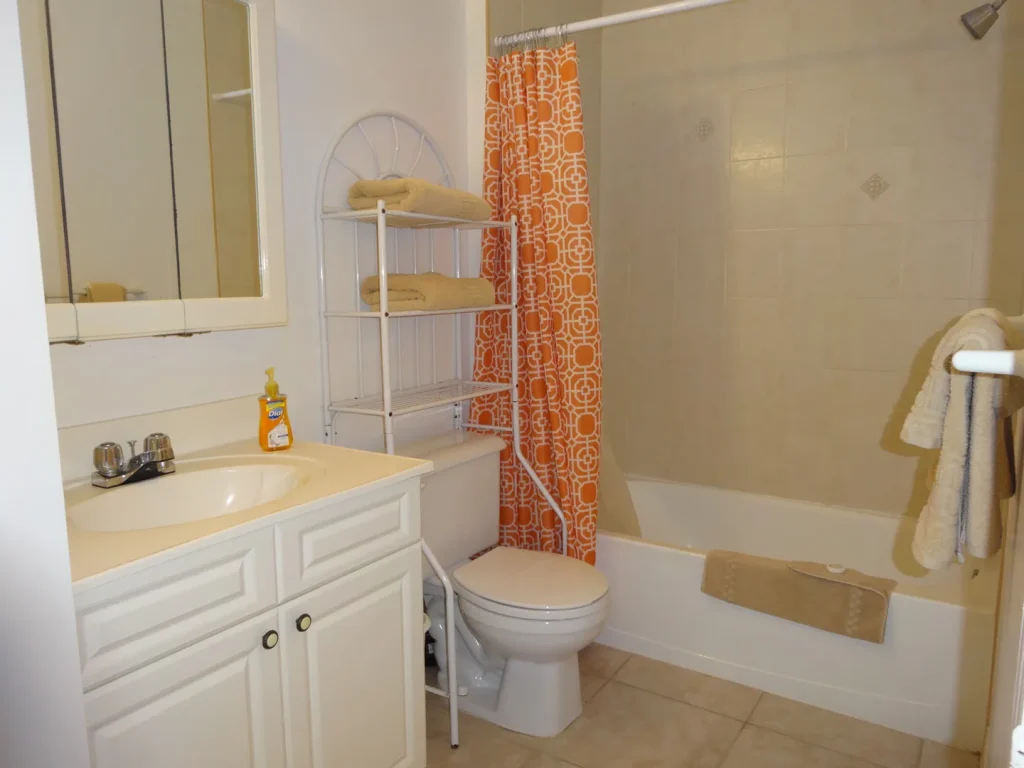 Bathroom with bath and shower at Sunset Paradise 2