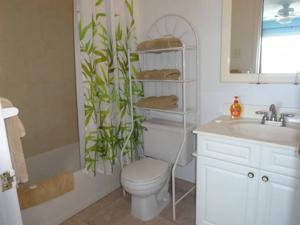 Bathroom with bath and shower at Sunset Paradise 4