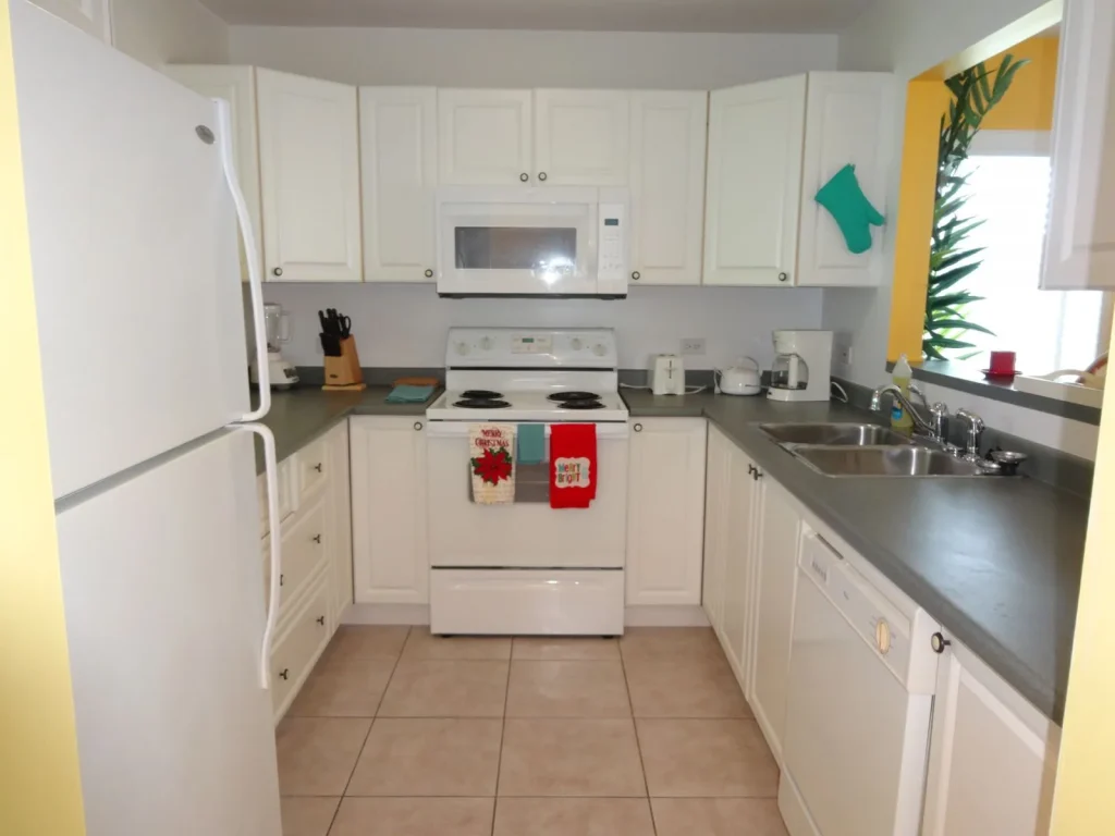 Fully equipped white kitchen at Sunset Paradise 4